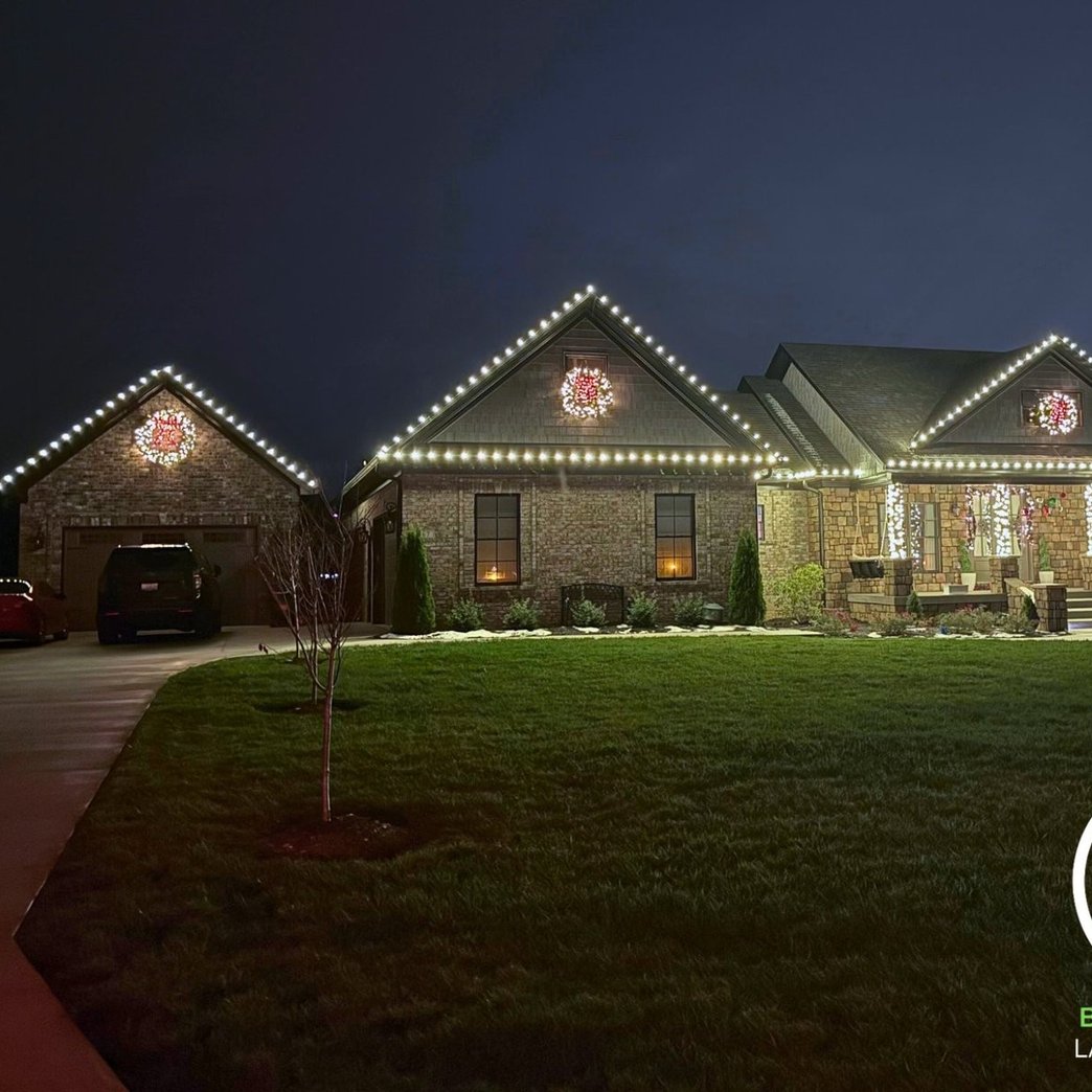 Christmas lights and wreaths installed on a craftsman home in Louisville KY