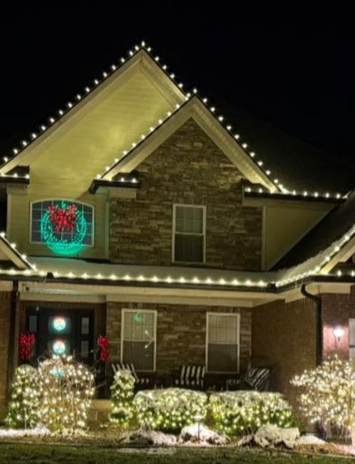 christmas lights wreaths two story home