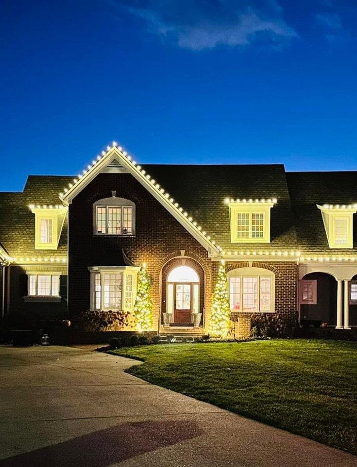 luxury home christmas light installation dusk