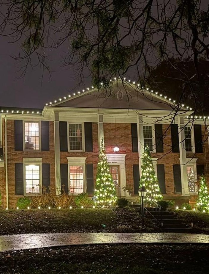 warm white christmas lights colonial home lighted trees