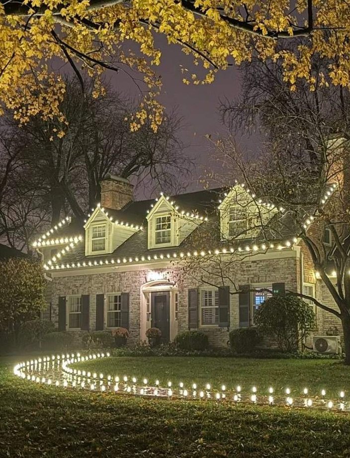 warm white christmas lights stone cottage pathway