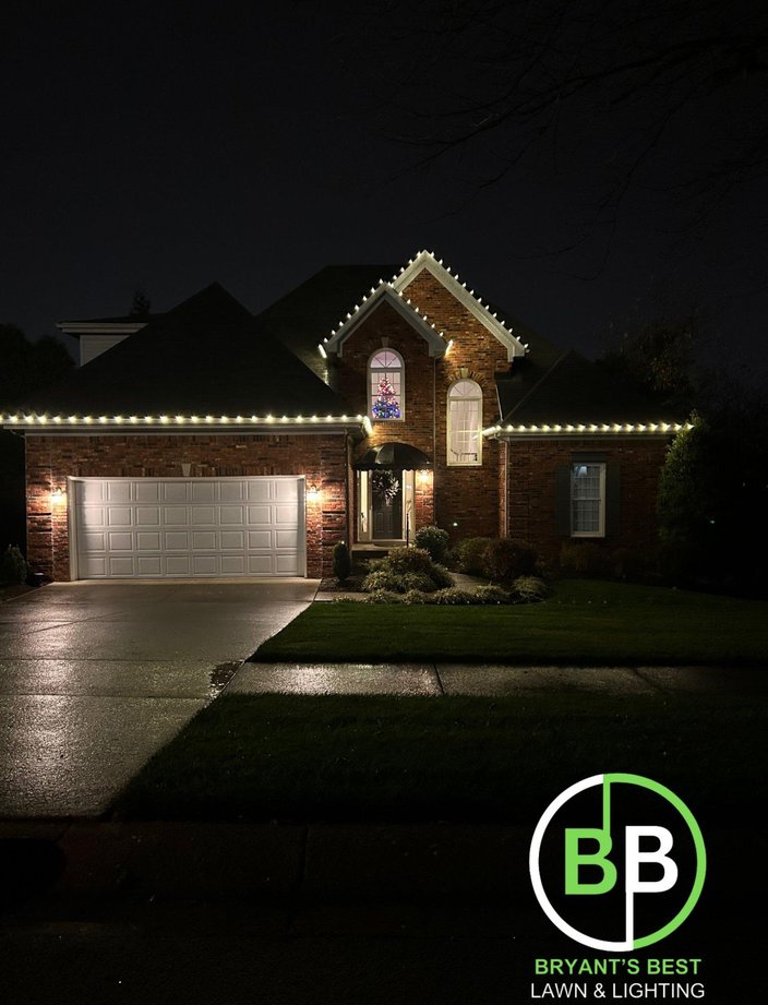 warm white christmas lights two story brick home